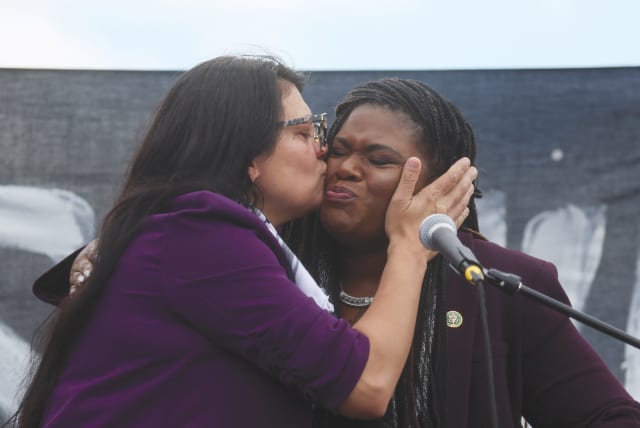  US REP. Rashida Tlaib (left) kisses Rep. Cori Bush as they take part in a protest outside the US Capitol in Washington last month, calling for a ceasefire in Gaza.  (photo credit: LEAH MILLIS/REUTERS)