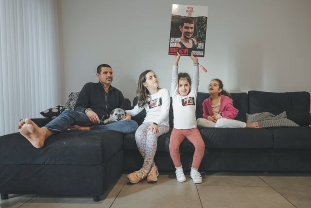  MICHAEL LEVY at home with his three daughters: ‘Now my mission is to bring him back. If I have to turn the world upside down to do so – so be it.’ (photo credit: CHEN SCHIMMEL)