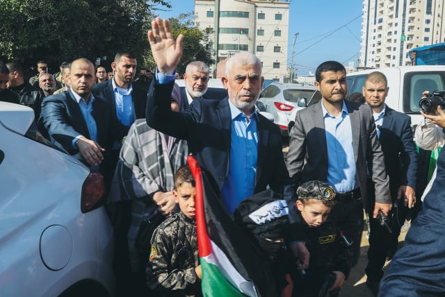  YAHYA SINWAR, leader of Hamas in Gaza, attends a rally in Gaza City marking the terror organization's 35th anniversary last December. Sinwar has once again aimed the arrow at Israel's Achilles' heel, argues the writer. (photo credit: ATIA MOHAMMED/FLASH90)