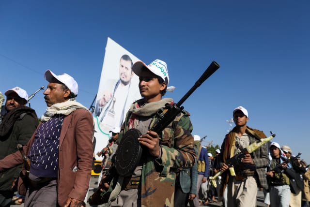 Newly-recruited fighters who joined a Houthi military force intended to be sent to fight in support of the Palestinians in the Gaza Strip, march during a parade in Sanaa, Yemen December 2, 2023 (photo credit: REUTERS/KHALED ABDULLAH)