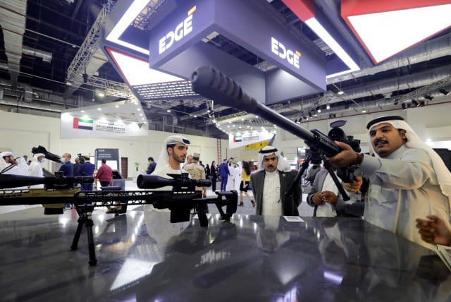  Visitors check a weapon at the UAE stand at Egypt Defence Expo (EDEX), showcasing military systems and hardware, in Cairo, Egypt, November 30, 2021. (photo credit: REUTERS/MOHAMED ABD EL GHANY)