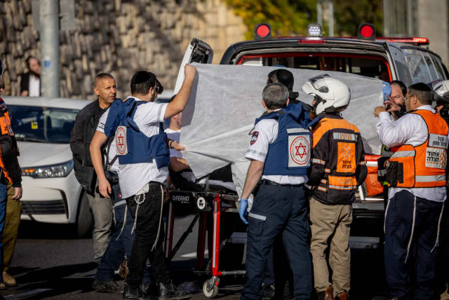  Israeli security at the scene of a terror shooting attack at the entrance to Jerusalem where Hamas-affiliated terrorists killed three Israelis and an IDF soldier killed one more, Yuval Castleman, Nov. 30, 2023. (photo credit: CHAIM GOLDBEG/FLASH90)