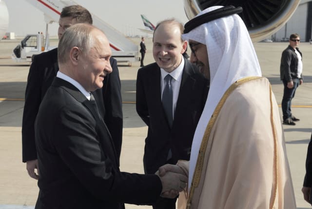  Russian President Vladimir Putin is welcomed by Minister of Foreign Affairs of the United Arab Emirates Sheikh Abdullah bin Zayed bin Sultan Al Nahyan upon arrival at the Abu Dhabi International Airport, United Arab Emirates December 6, 2023 (photo credit: Sputnik/Andrey Gordeev/Pool via REUTERS)