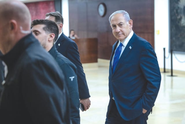  Prime Minister Benjamin Netanyahu walks from his office in the Knesset, last week. In the US, there are deepening political divisions over the strong American support for Israel during the current war, says the writer. (photo credit: CHAIM GOLDBEG/FLASH90)