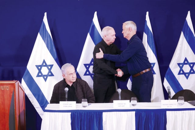  Prime Minister Benjamin Netanyahu, Defense Minister Yoav Gallant and Minsiter Benny Gantz at a press conference. (photo credit: MARC ISRAEL SELLEM)