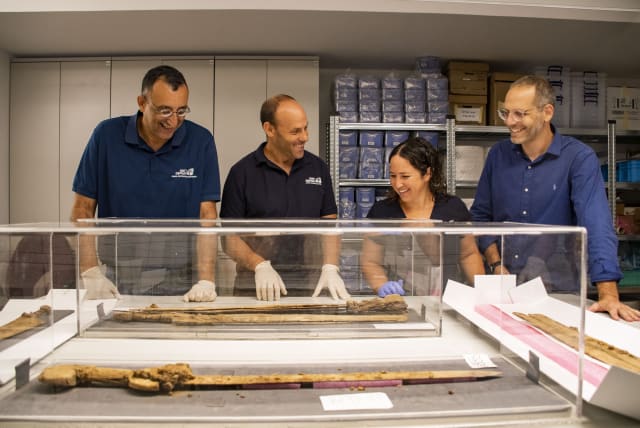  From right to left: Dr. Asaf Gayer, Oriya Amichay Dr. Eitan Klein and Amir Ganor with their findings (photo credit: YOLI SCHWARTZ/ISRAEL ANTIQUITIES AUTHORITY)