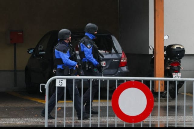 Police secure the area after a shooting in the Swiss town of Sion, Switzerland, December 11, 2023. (photo credit: DENIS BALIBOUSE/REUTERS)