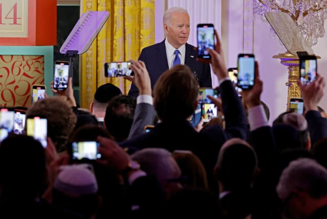 US President Joe Biden delivers remarks during a Hanukkah holiday reception in the East Room of the White House on December 11, 2023 in Washington, DC, US. (photo credit: CHIP SOMODEVILLA/POOL VIA REUTERS)