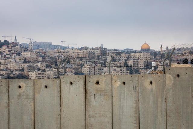  View of the Separation Wall and the Al-Aqsa compound in the background on February 02, 2020.  (photo credit: OLIVIER FITOUSSI/FLASH90)