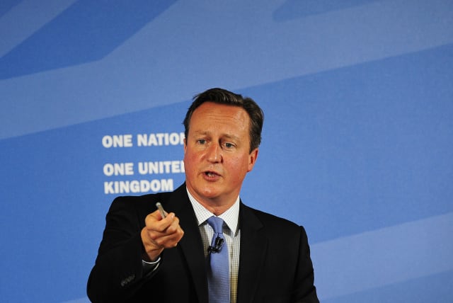  Britain's Prime Minister David Cameron gestures as he speaks in Leeds, Britain September 11, 2015. Cameron said on Friday he was extremely worried about the political crisis in Northern Ireland where the power-sharing government is on the brink of collapse. (photo credit: REUTERS/John Giles/Pool)