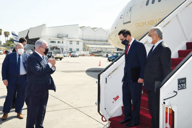  PRIME MINISTER Benjamin Netanyahu greets US Treasury secretary Steve Mnuchin and UAE’s Minister of State for Financial Affairs at Ben-Gurion Airport.  (photo credit: WAM/HANDOUT VIA REUTERS)