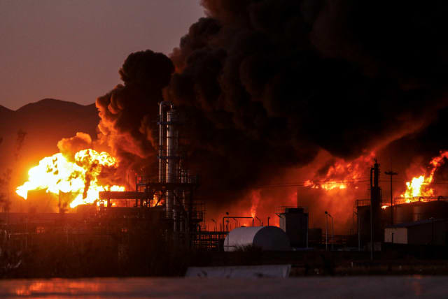 A general view of fire at an oil refinery in Birjand, Iran, December 10, 2023. (photo credit: Mohsen Noferesti/IRNA/WANA Handout via REUTERS)