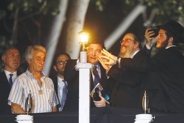  ARGENTINA’S PRESIDENT Javier Milei takes part in a Hanukkah celebration in Buenos Aires, last week.  (photo credit: Tomas Cuesta/Reuters)