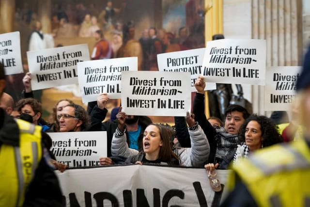  Protesters call for a ceasefire and an end to US military funding in the ongoing conflict between Israel and the Palestinian Islamist group Hamas, as they demonstrate inside the Rotunda of the US Capitol in Washington DC, December 19, 2023. (photo credit: REUTERS/ELIZABETH FRANTZ)