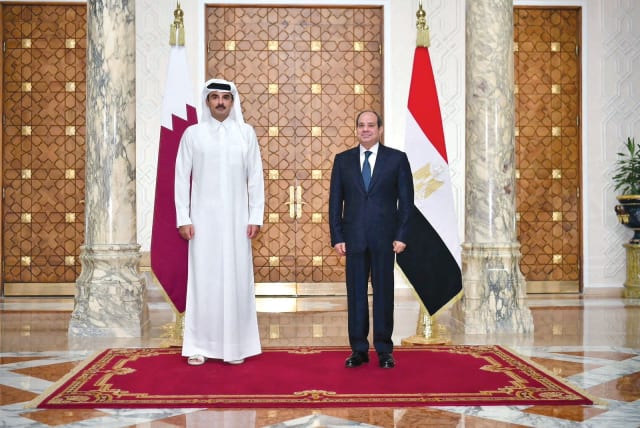  Egypt’s President Abdel Fattah El-Sisi meets Qatar’s Emir Sheikh Tamim bin Hamad Al Thani at the Ittihadiya presidential palace in Cairo on November 10. (photo credit: Egyptian Presidency/Reuters)