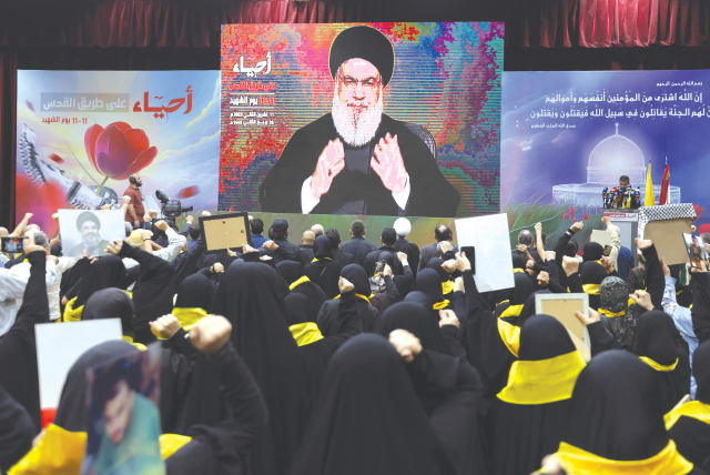  HEZBOLLAH LEADER Hassan Nasrallah addresses his supporters during a rally commemorating the annual Hezbollah Martyrs’ Day, in Beirut last month.  (photo credit: AZIZ TAHER/REUTERS)