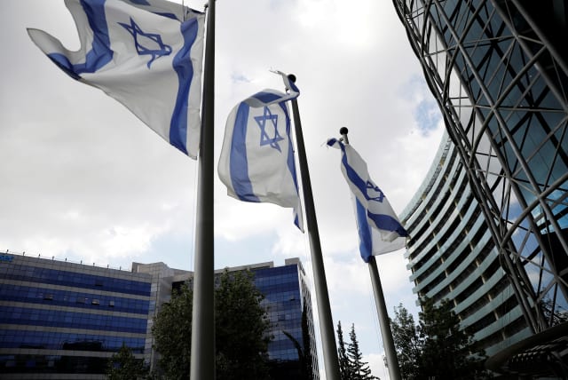  Israeli flags flutter at Ofer Park in Petah Tikva, which houses hi-tech companies. (photo credit: RONEN ZVULUN/REUTERS)