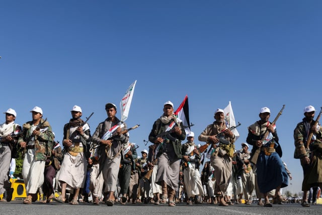  Newly recruited fighters who joined a Houthi military force intended to be sent to fight in support of the Palestinians in the Gaza Strip, march during a parade in Sanaa, Yemen December 2, 2023. (photo credit: REUTERS/KHALED ABDULLAH)