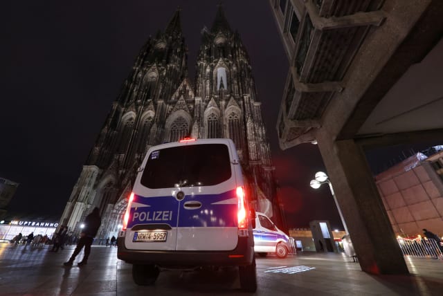 German police secures the cathedral in central Cologne, Germany, December 23, 2023. (photo credit: THILO SCHMUELGEN/REUTERS)