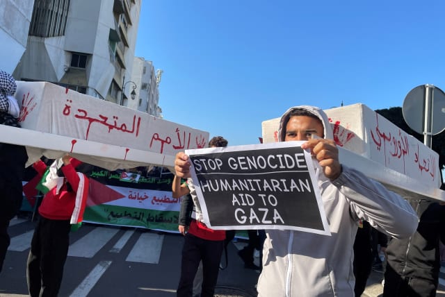  Protesters carry representations of caskets, at a demonstration calling for an end to Morocco's ties with Israel, amid the ongoing conflict between Israel and Palestinian Islamist group Hamas, in Rabat, Morocco December 24, 2023. (photo credit: REUTERS/Ahmed El Jechtimi)