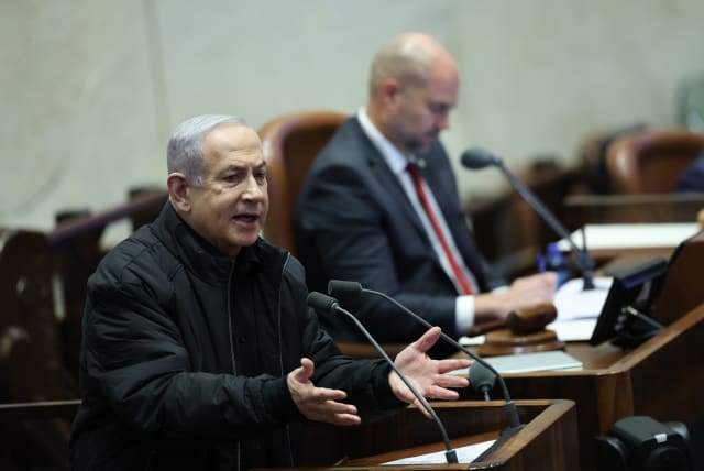  Prime Minister Benjamin Netanyahu speaks at the Knesset plenum on December 25, 2023 (photo credit: YONATAN SINDEL/FLASH90)