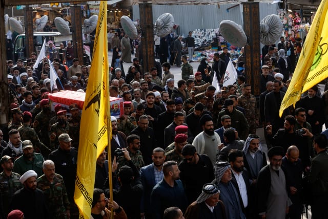  People carry the coffin of senior adviser for Iran's Revolutionary Guards, Sayyed Razi Mousavi, who was killed in an Israeli air strike outside the Syrian capital Damascus, during his funeral in Najaf, Iraq, December 27, 2023. (photo credit: REUTERS/ALAA AL-MARJANI)