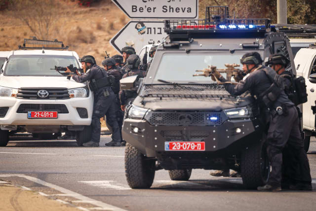  ISRAELI FORCES outside the entrance to the south of Sderot, with Hamas to the west, on October 8. (photo credit: Chaim Goldberg/Flash90)