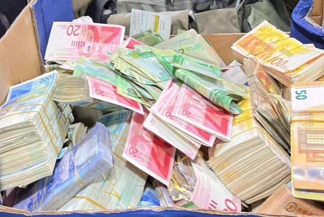  Cash seized overnight in the West Bank by Israeli security forces. December 26, 2023. (photo credit: IDF SPOKESPERSON'S UNIT)