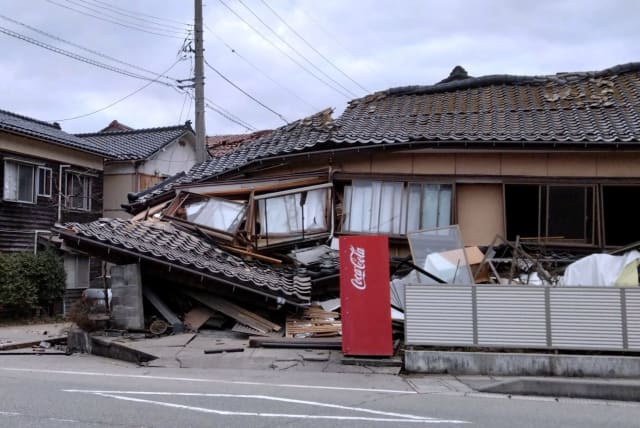  A collapsed house following an earthquake is seen in Wajima, Ishikawa prefecture, Japan January 1, 2024, in this photo released by Kyodo. (photo credit:  Kyodo via REUTERS)
