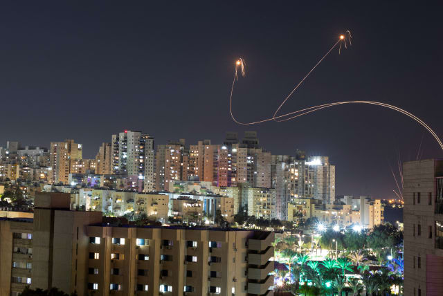  Israel's Iron Dome anti-missile system intercepts rockets launched from the Gaza Strip, amid the ongoing conflict between Israel and the Palestinian Islamist group Hamas, as seen from Ashkelon, Israel, December 25, 2023.  (photo credit: AMIR COHEN/REUTERS)