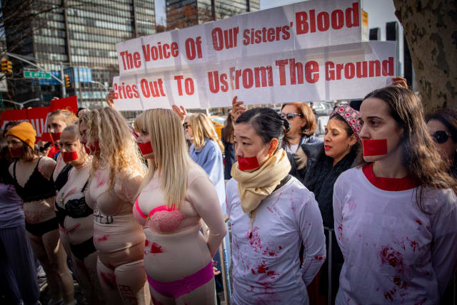  Demonstrators gather during a protest the crimes and sexual violence against women in October 7 massacre, outside of United Nations headquarters in New York City, on December 4, 2023.  (photo credit: YAKOV BINYAMIN/FLASH 90)