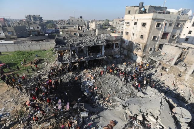  A building destroyed by Air Force strikes in the city of Rafah in the southern Gaza Strip, December 19, 2023 (photo credit: REUTERS)