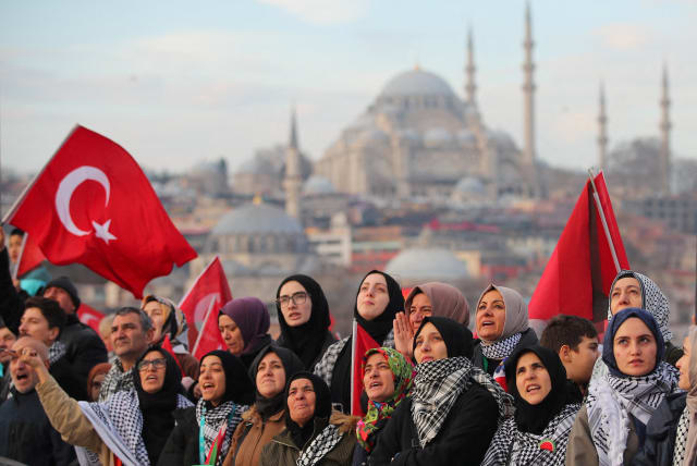  People gather over the Galata Bridge in solidarity with Palestinians, amid the ongoing conflict between Israel and Hamas, following the first morning prayer of the New Year in Istanbul, Turkey January 1, 2024 (photo credit: REUTERS/DILARA SENKAYA)