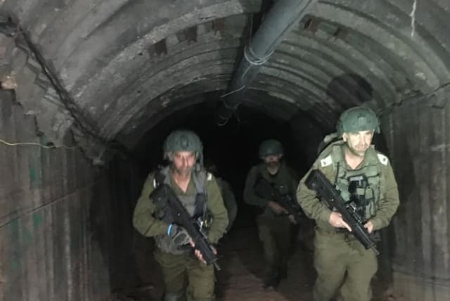  IDF soldiers operating in the tunnel used by Yahya Sinwar's brother in the Gaza Strip (photo credit: BENJAMIN WEINTHAL)