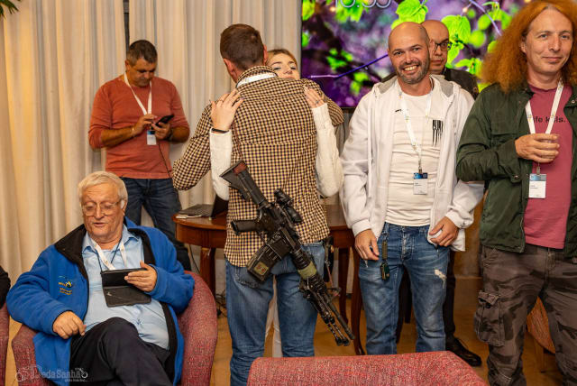  Israeli military reservists were among the 150 people with roots in the former Soviet Union who gathered on Dec. 21, 2023, for an evening of lectures, music and solidarity with Israel.  (photo credit: Alexander Khanin via JTA)
