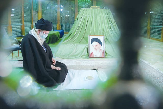  IRAN’S SUPREME Leader Ayatollah Ali Khamenei prays at the tomb of the late leader Ayatollah Ruhollah Khomeini, on the 44th anniversary of Khomeini’s return from exile in Paris, at his mausoleum in Tehran, January 31, 2023. (photo credit: Office of the Iranian Supreme Leader/West Asia News Agency/Reuters)