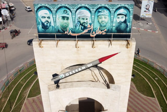 A picture taken with a drone shows a monument of a Hamas rocket with pictures of late commanders from armed Palestinian factions, in Rafah in the southern Gaza Strip February 2, 2021 (photo credit: REUTERS/MOHAMMED SALEM)