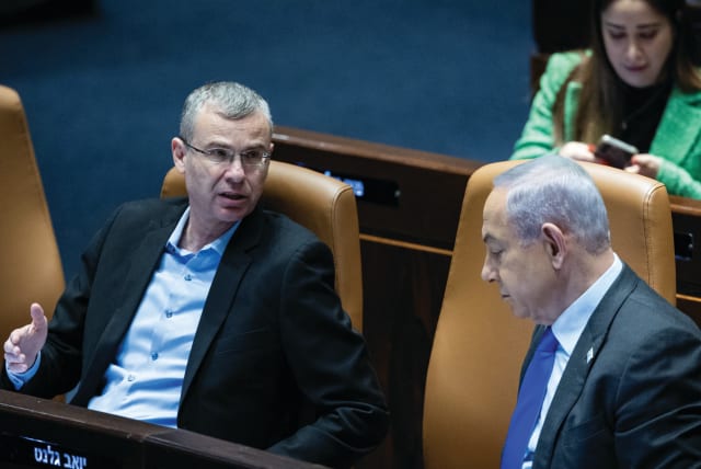  JUSTICE MINISTER Yariv Levin speaks with Prime Minister Benjamin Netanyahu in the Knesset plenum last month. In its decision, the High Court essentially dissolves the Knesset, irrespective of the individuals occupying its seats, the writer argues.  (photo credit: YONATAN SINDEL/FLASH90)