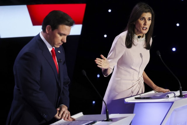 Florida Governor Ron DeSantis and Former U.S. Ambassador to the United Nations Nikki Haley participate in the Republican presidential debate hosted by CNN at Drake University in Des Moines, Iowa, U.S. January 10, 2024. (photo credit: REUTERS/MIKE SEGAR)