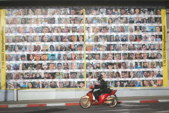  A BILLBOARD in Tel Aviv displays the photos of the hostages currently being held by Hamas in Gaza. (photo credit: MIRIAM ALSTER/FLASH90)