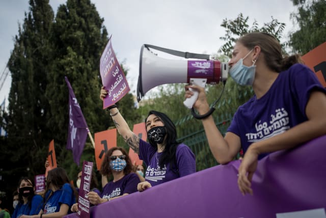 Members of the "Standing Together" movement protest for equal rights of financial support, outside the Israeli parliament on May 14, 2020. (photo credit: YONATAN SINDEL/FLASH90)