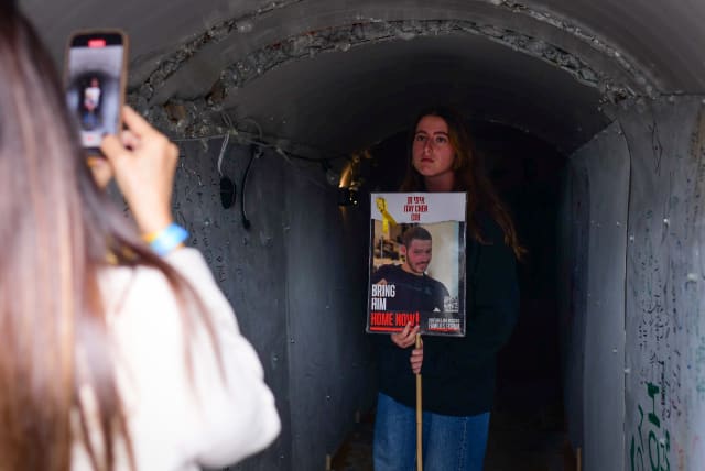  Families of Israelis held hostage by Hamas terrorists in Gaza standing outside a tunnel installation at Hostages Square in Tel Aviv on January 13, 2024 (photo credit: TOMER NEUBERG/FLASH90)