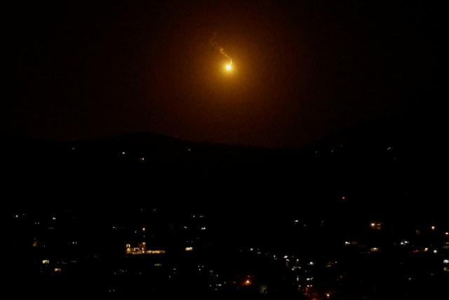  A flare falls, as seen from Tyre looking towards the Lebanese-Israeli border where Hezbollah has been exchanging fire with Israeli forces, Lebanon November 19, 2023. (photo credit: ALAA AL-MARJANI/REUTERS)