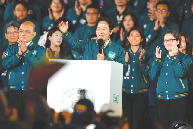  Aiwan President-elect Lai Ching-te, flanked by his running mate Hsiao Bi-khim (right), speaks on stage at a rally in Taipei on Saturday, following his election victory. (photo credit: CARLOS GARCIA RAWLINS/REUTERS)