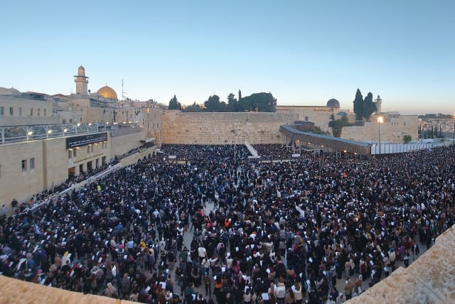  A mass prayer event for the welfare of the hostages in Gaza takes place at the Western Wall last week. (photo credit: MARC ISRAEL SELLEM/THE JERUSALEM POST)