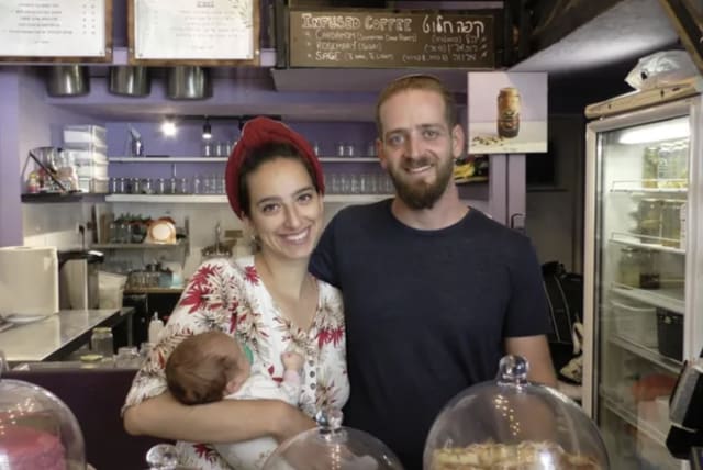  Infused JLM owners Maor and Diana Shapira, with their newborn daughter, in their shop. (photo credit: Courtesy Infused JLM)