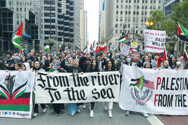 PALESTINIAN AMERICANS and their supporters march in downtown Chicago, on October 8, the day after the Hamas massacres in Israel. ‘Following October 7, I have felt isolated, frustrated, angry, and afraid,’ says the writer. (photo credit: ERIC COX/REUTERS)