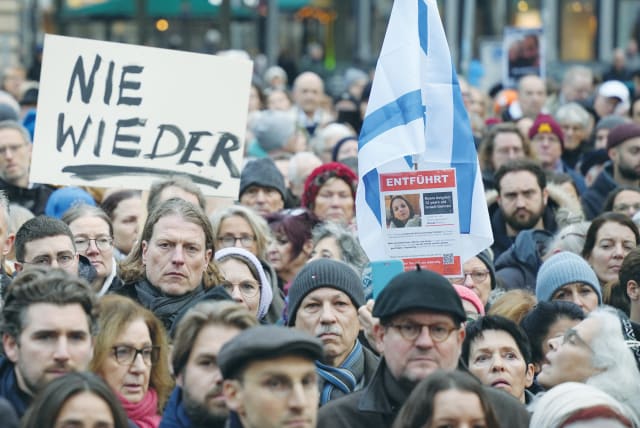  A PLACARD reads ‘Never Again,’ at a demonstration in Frankfurt, in November, supporting Israel and calling for the release of the hostages held by Hamas. (photo credit: MAX SCHWARZ/REUTERS)