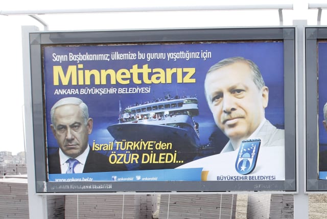  A billboard showing Turkey's President Erdogan (R) and Israeli Prime Minister Benjamin Netanyahu (L), in Ankara March 25, 2013 (photo credit: UMIT BEKTAS/REUTERS)