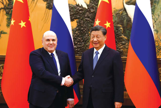  CHINESE PRESIDENT Xi Jinping and Russian Prime Minister Mikhail Mishustin meet in Beijing, last month. Neither country reportedly has said much about South Africa’s case against Israel and both are themselves facing accusations of genocide, the writer notes. (photo credit: SPUTNIK/REUTERS)